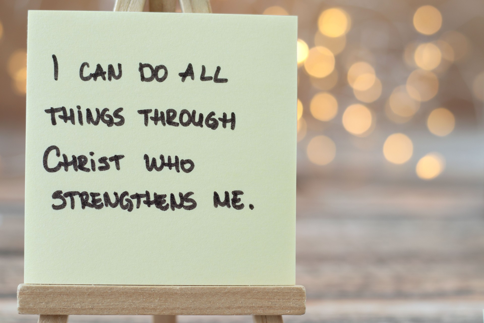 I can do all things through Christ who strengthens me, handwritten Christian quote (Philippians 4:13) with bokeh background